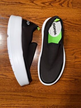 OOFOS Black Slip-On Sneakers with Neon Green Insole and White Platform